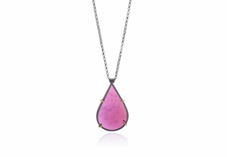 A rhodolite garnet slice set in oxidised silver and 18ct gold on an oxidised silver chain.